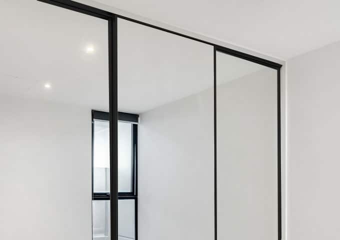 black framed mirror sliding wardrobe doors