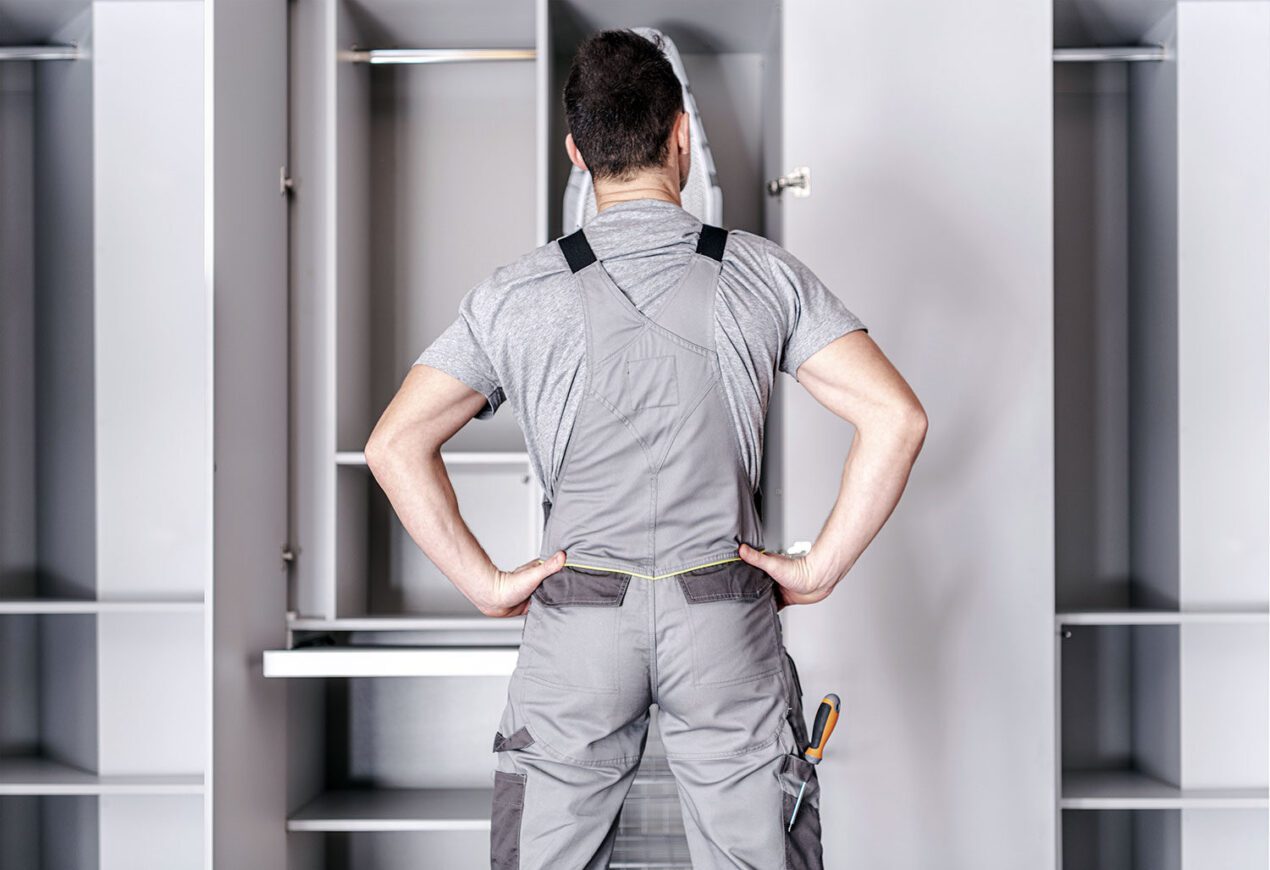 Building your own wardrobe – installer assembling custom wardrobe interior