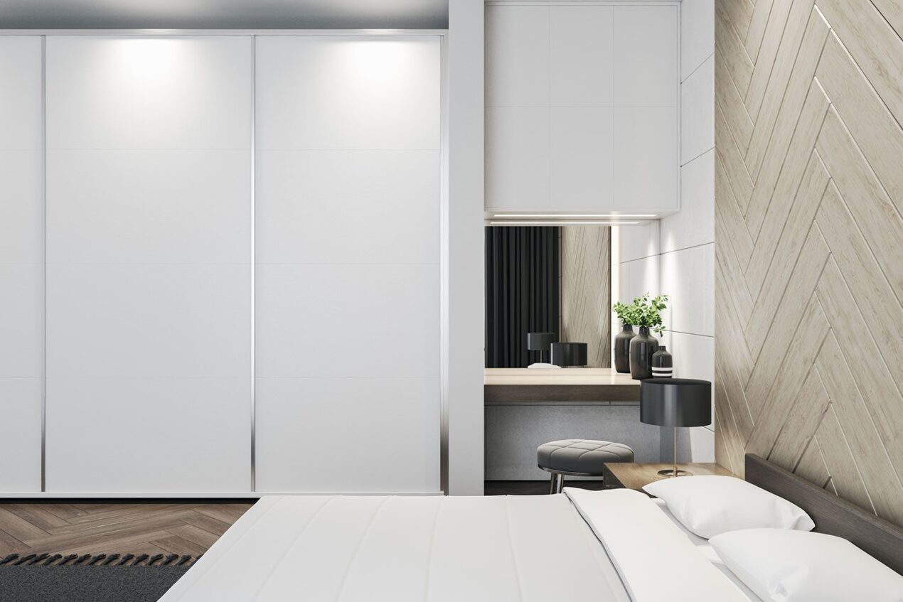 Clean, minimalist bedroom interior with sleek sliding robe doors in Brisbane