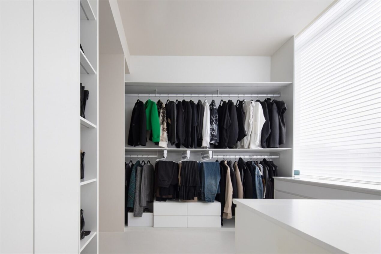 Built-in walk-in wardrobes with hanging rails and open shelving, perfect for Gold Coast homes