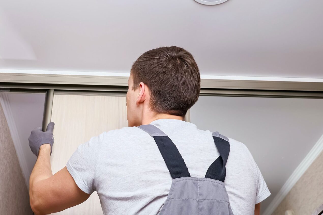 Adjusting installed tracks and doors for sliding wardrobes to ensure smooth operation