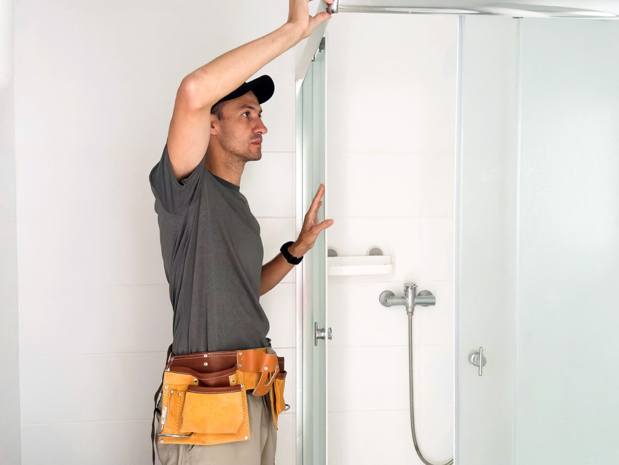 Shower screen manufacturer installing a new shower screen