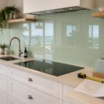 Glass splashback cost Gold Coast guide showing a custom sage-green kitchen splashback