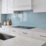 Kitchen splashback ideas Gold Coast article showing a coastal blue glass splashback in a Hamptons kitchen