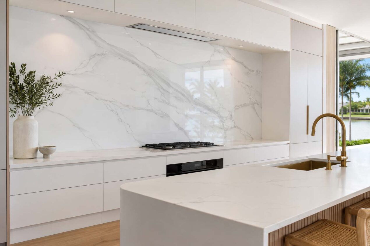Marble-look glass kitchen splashback in a statement Gold Coast kitchen