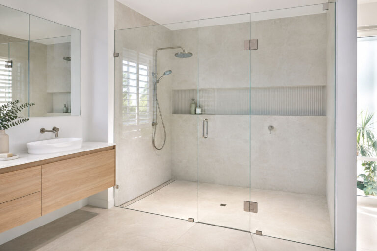Custom frameless shower screen installed in a contemporary Gold Coast bathroom