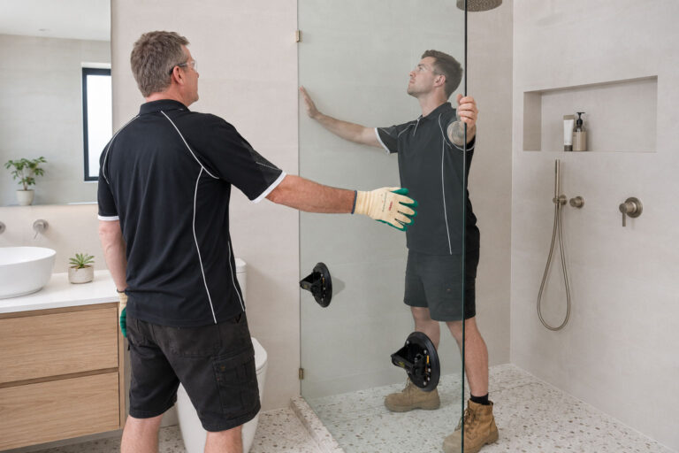 Professional installation of a custom frameless shower screen in a Gold Coast bathroom