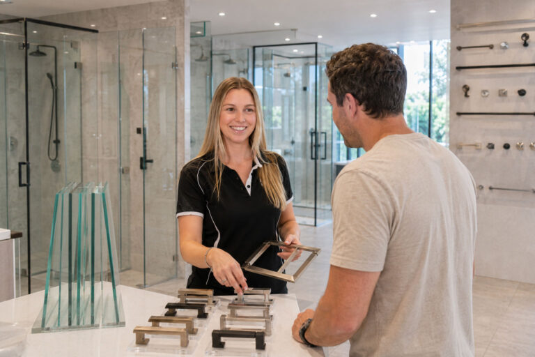 Homeowner discussing custom shower screen options during a shower screen consultation