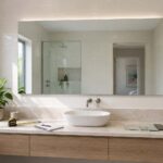 Bathroom mirror size guide showing a made-to-measure frameless mirror above a Gold Coast vanity