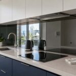 Mirror splashback pros and cons shown in a compact Gold Coast kitchen